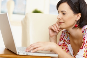 Young woman browsing internet at home